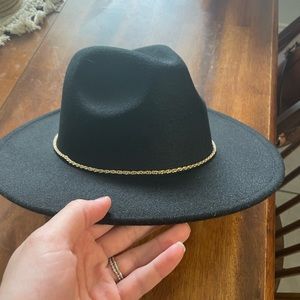 Women’s fedora hat in black with gold chain detailing